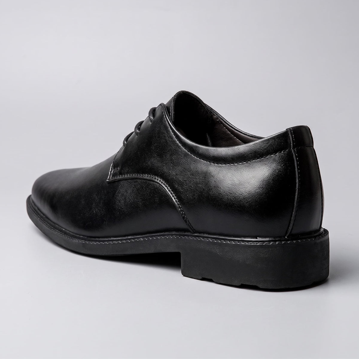 FORCIANO PRESTIGE Height Increasing Shoes in black Sleek style shown from a rear three-quarter angle.