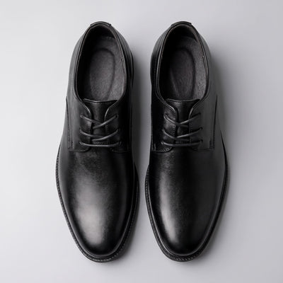Pair of black Sleek-style FORCIANO PRESTIGE Height Increasing Shoes displayed from the top view.