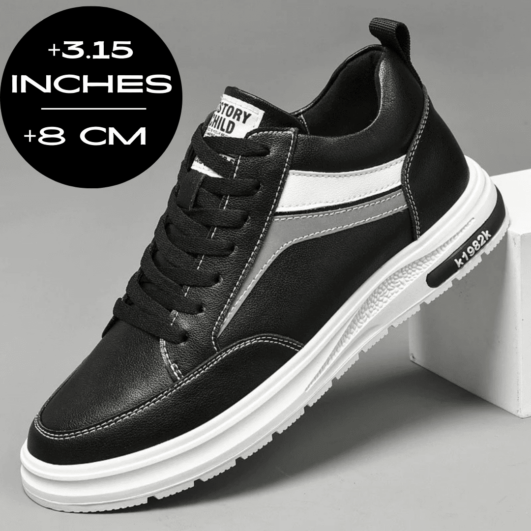 FORCIANO PRIME black and white height increasing sneakers with gray reflective accents shown from a front three-quarter angle with an 8 cm / 3.15" height increase graphic.
