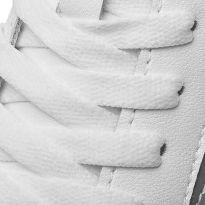 Close-up of white laces and textured upper detailing on FORCIANO PRIME white height increasing sneakers.