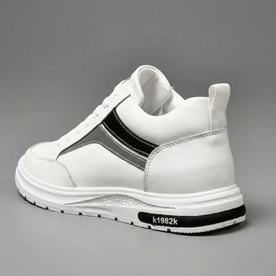 FORCIANO PRIME white height increasing sneakers with black and gray reflective accents shown from a rear three-quarter angle, highlighting the heel and side profile.
