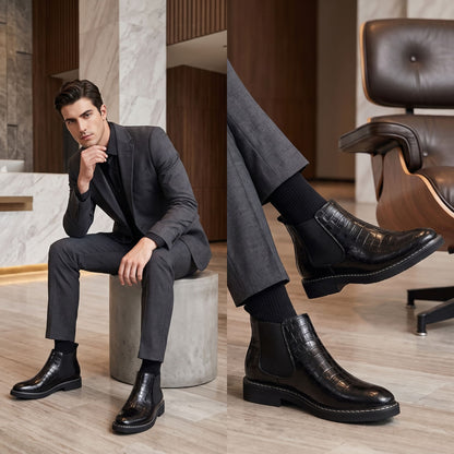 FORCIANO RAPTOR men's elevator boots in black worn with a dark suit in an indoor formal lifestyle scene with close-up boot detail.