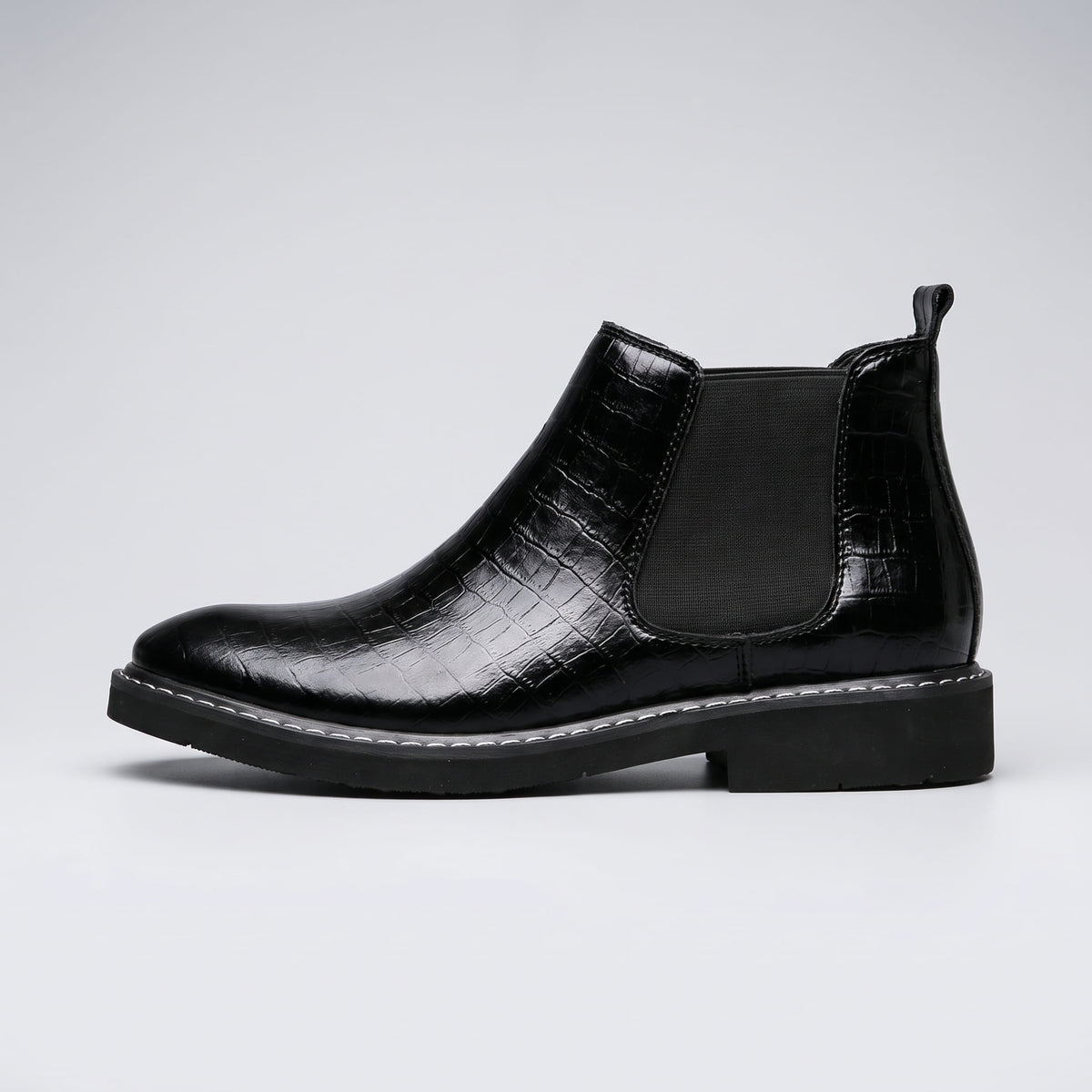 FORCIANO RAPTOR men's elevator boots in black shown in a clean side profile with elastic side panel, pull tab and textured upper.