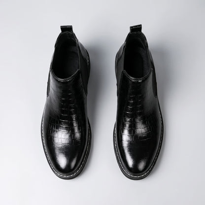 FORCIANO RAPTOR men's elevator boots in black shown as a pair from the top view, displaying the openings, textured uppers and pull tabs.
