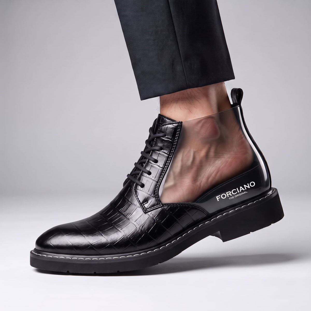 FORCIANO RAPTOR men's elevator boots in black shown on foot with a cutaway-style side section displaying foot placement inside the boot.