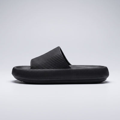 FORCIANO REESE black height increasing slippers for women shown from the side profile, highlighting the textured EVA upper and elevated sole shape.