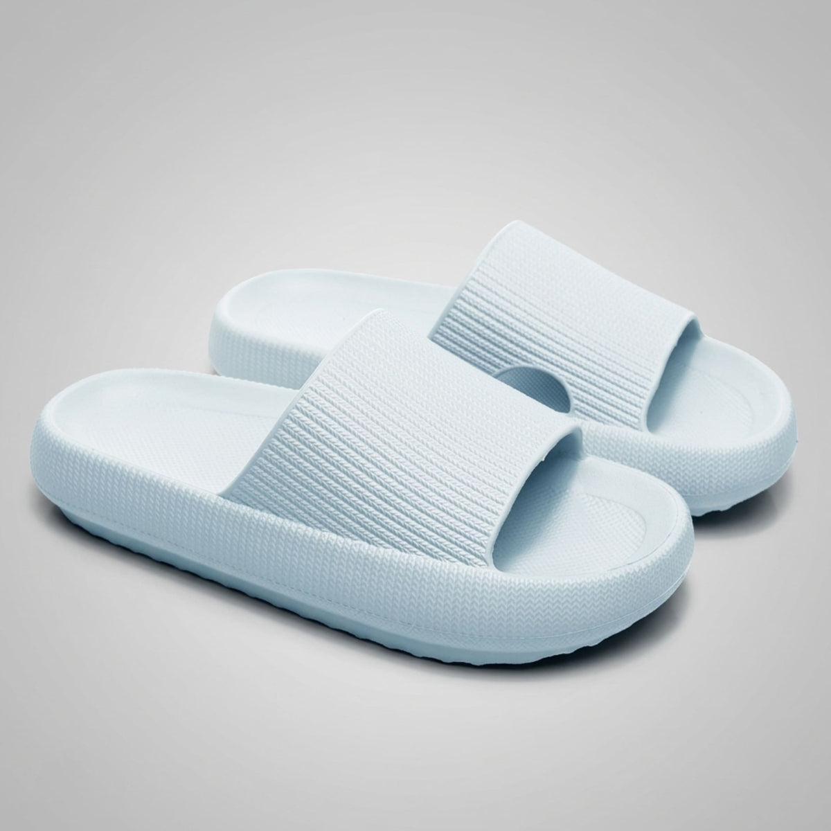 FORCIANO REESE light blue height increasing slippers for women shown as a pair from a front three-quarter angle with textured lightweight EVA uppers.