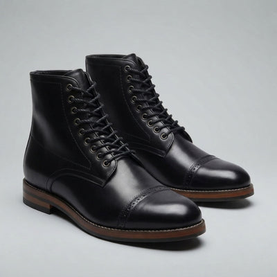 FORCIANO ROMANO black height increasing boots with genuine leather uppers shown as a pair from a front three-quarter angle with cap-toe detailing.