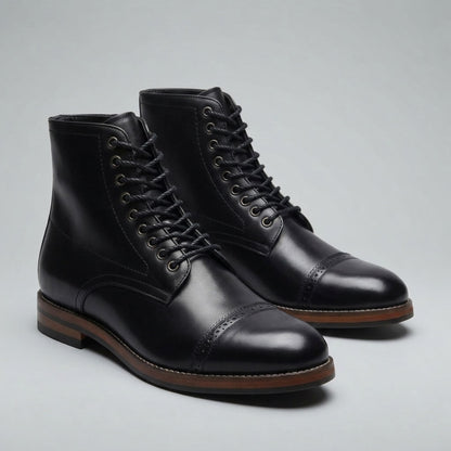 FORCIANO ROMANO black height increasing boots with genuine leather uppers shown as a pair from a front three-quarter angle with cap-toe detailing.