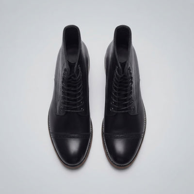 FORCIANO ROMANO black height increasing boots with genuine leather uppers shown as a pair from above with lace-up fronts and cap toes visible.