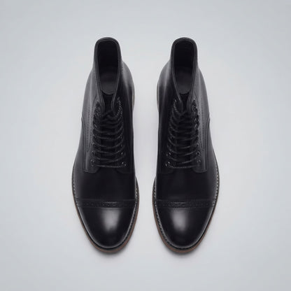 FORCIANO ROMANO black height increasing boots with genuine leather uppers shown as a pair from above with lace-up fronts and cap toes visible.