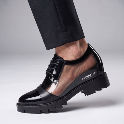 FORCIANO ROYALE black Height Increasing Shoes shown worn in a cutaway view revealing the internal lift beneath the sleek leather design.