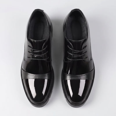 FORCIANO ROYALE black Height Increasing Shoes shown as a pair from the top, highlighting the sleek leather design, lacing and front straps.