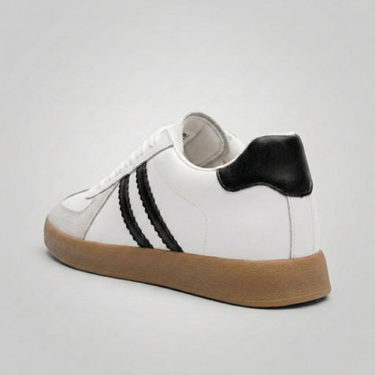 FORCIANO SABER white height increasing sneaker with black heel accent, side stripes and split leather upper shown from a rear three-quarter angle.