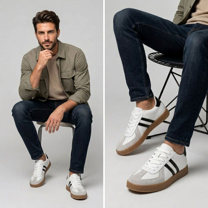 FORCIANO SABER white height increasing sneakers with black stripes and split leather uppers worn by a seated male model with dark jeans.
