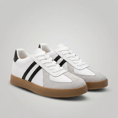 FORCIANO SABER white height increasing sneakers with black stripes, gum soles and split leather uppers shown as a pair from a front three-quarter angle.
