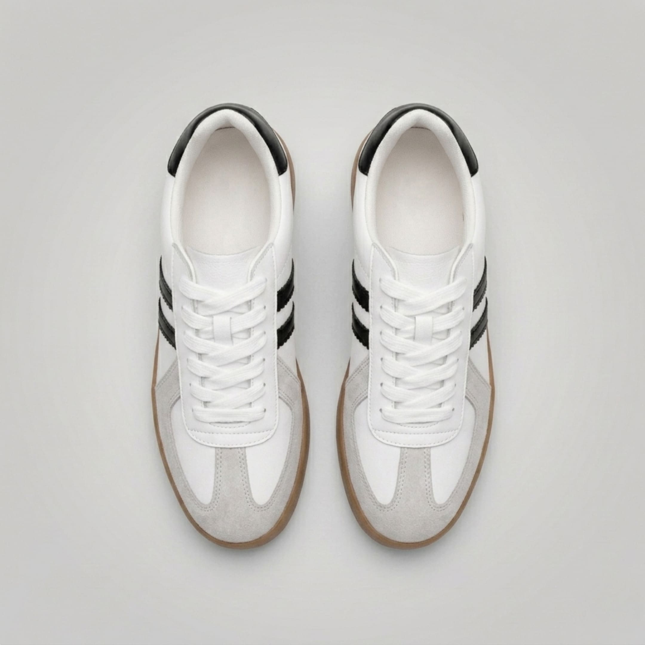FORCIANO SABER white height increasing sneakers with black heel accents and split leather uppers shown as a pair from the top.