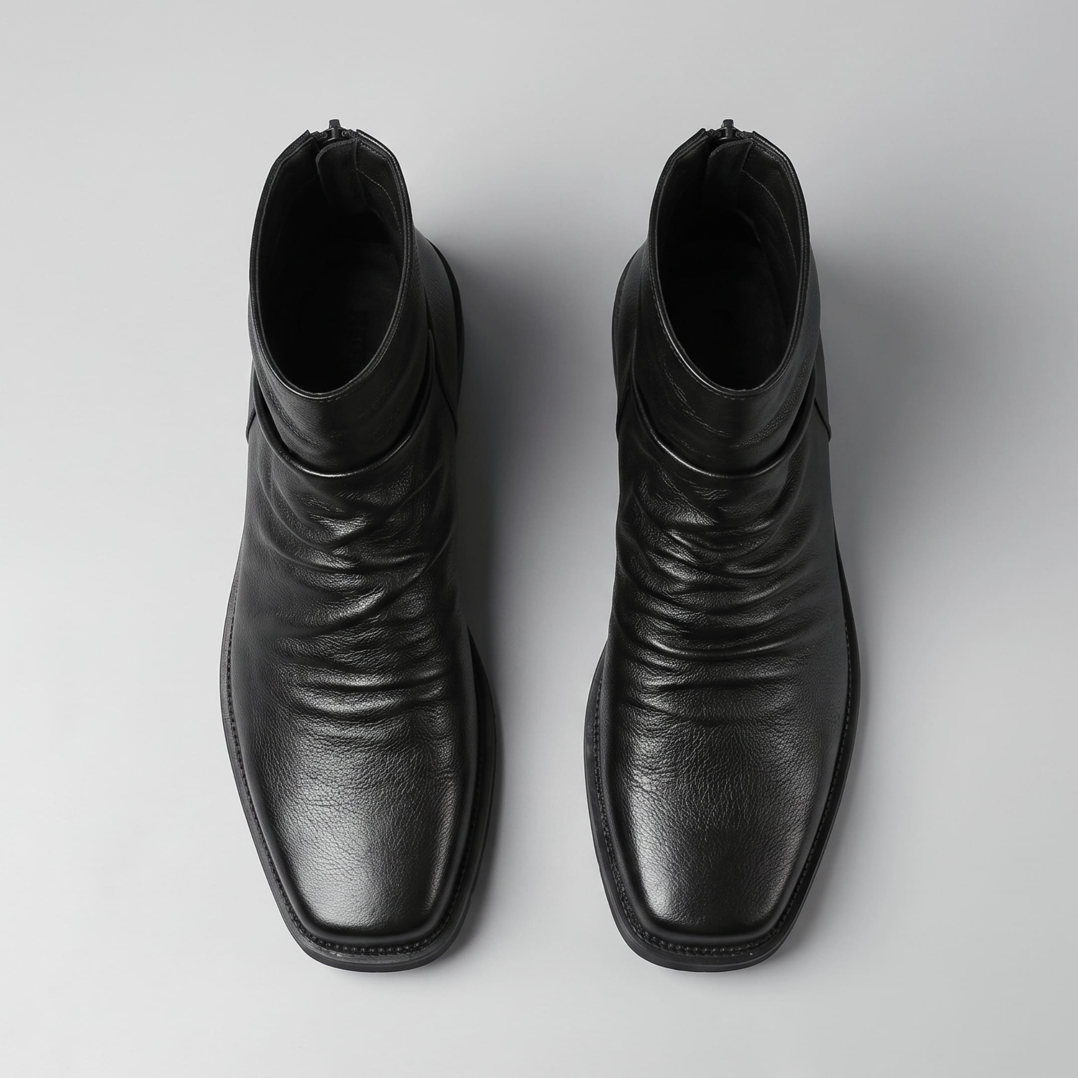 FORCIANO SALVATI black height increasing boots with smooth microfiber uppers shown as a pair from above, highlighting the gathered front design.