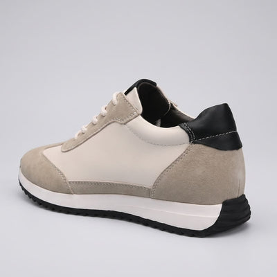 FORCIANO SALVATORE beige height increasing sneakers with cow suede upper, black heel accent and white midsole shown from the rear three-quarter angle.