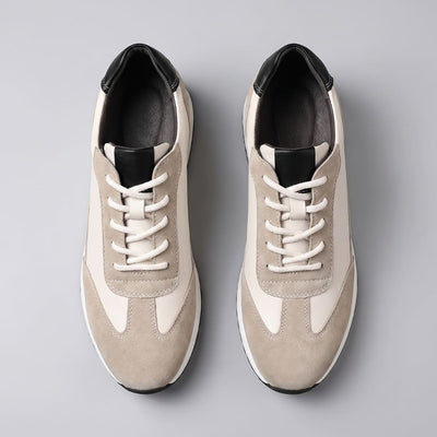 FORCIANO SALVATORE beige height increasing sneakers with cow suede uppers and black accents shown as a pair from the top with white laces.