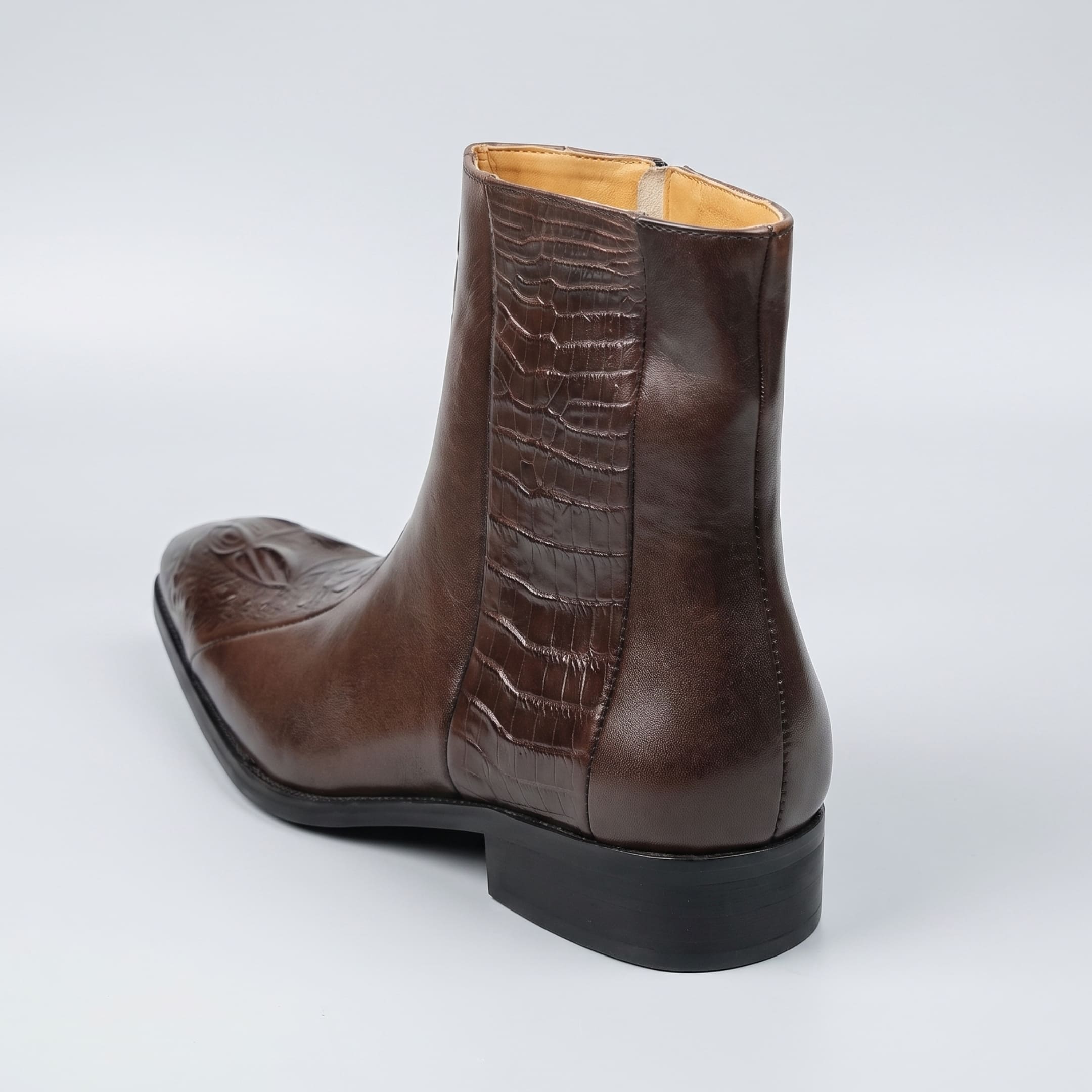 FORCIANO SAVIERO coffee elevator boot with genuine leather upper and crocodile-engraved rear panel shown from a rear three-quarter angle.