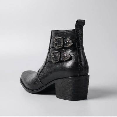 FORCIANO SCAROSSO black genuine leather height increasing boot shown from the rear three-quarter angle with double buckles, textured upper and block heel.