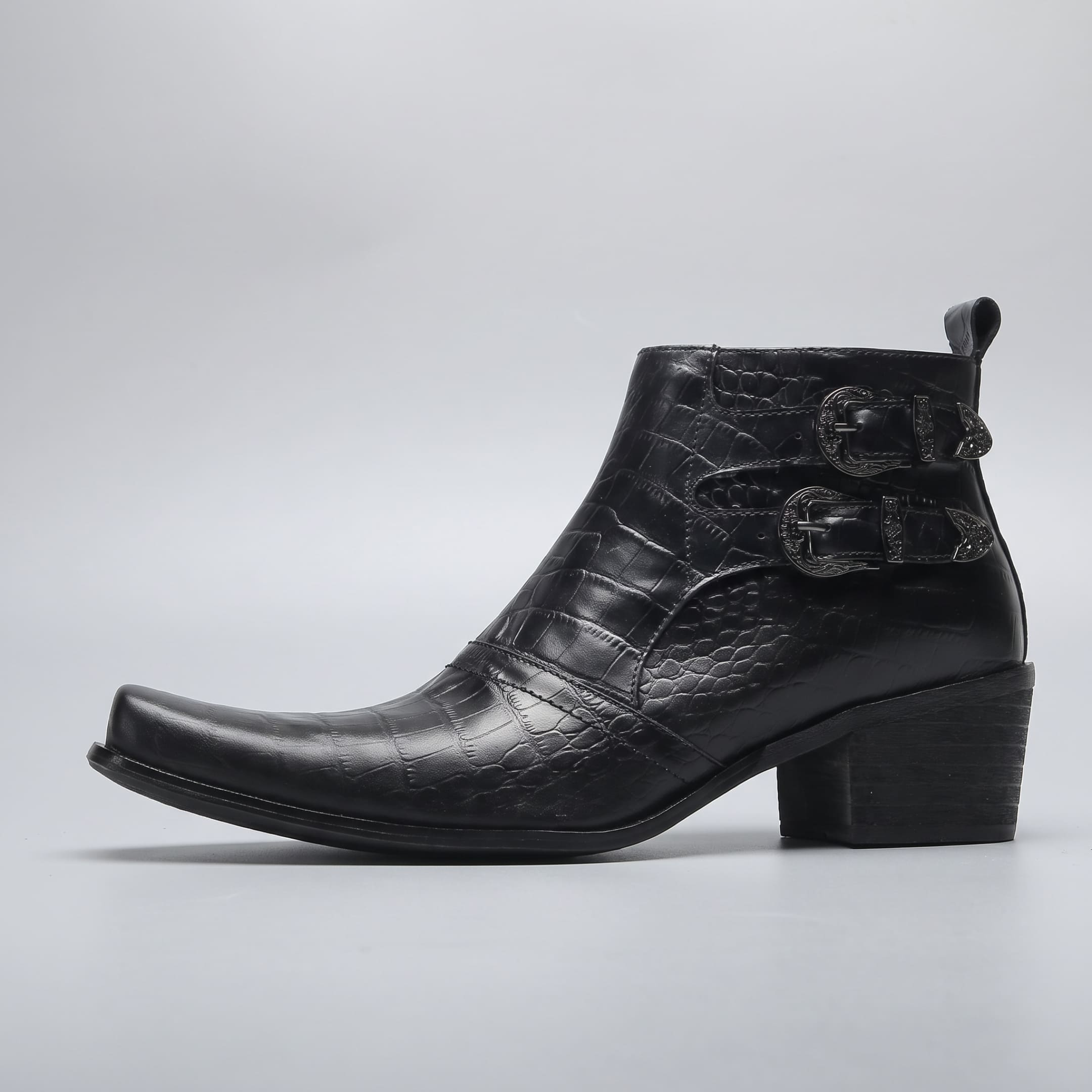FORCIANO SCAROSSO black genuine leather height increasing boot in side profile with textured leather, two buckle straps and a block heel.