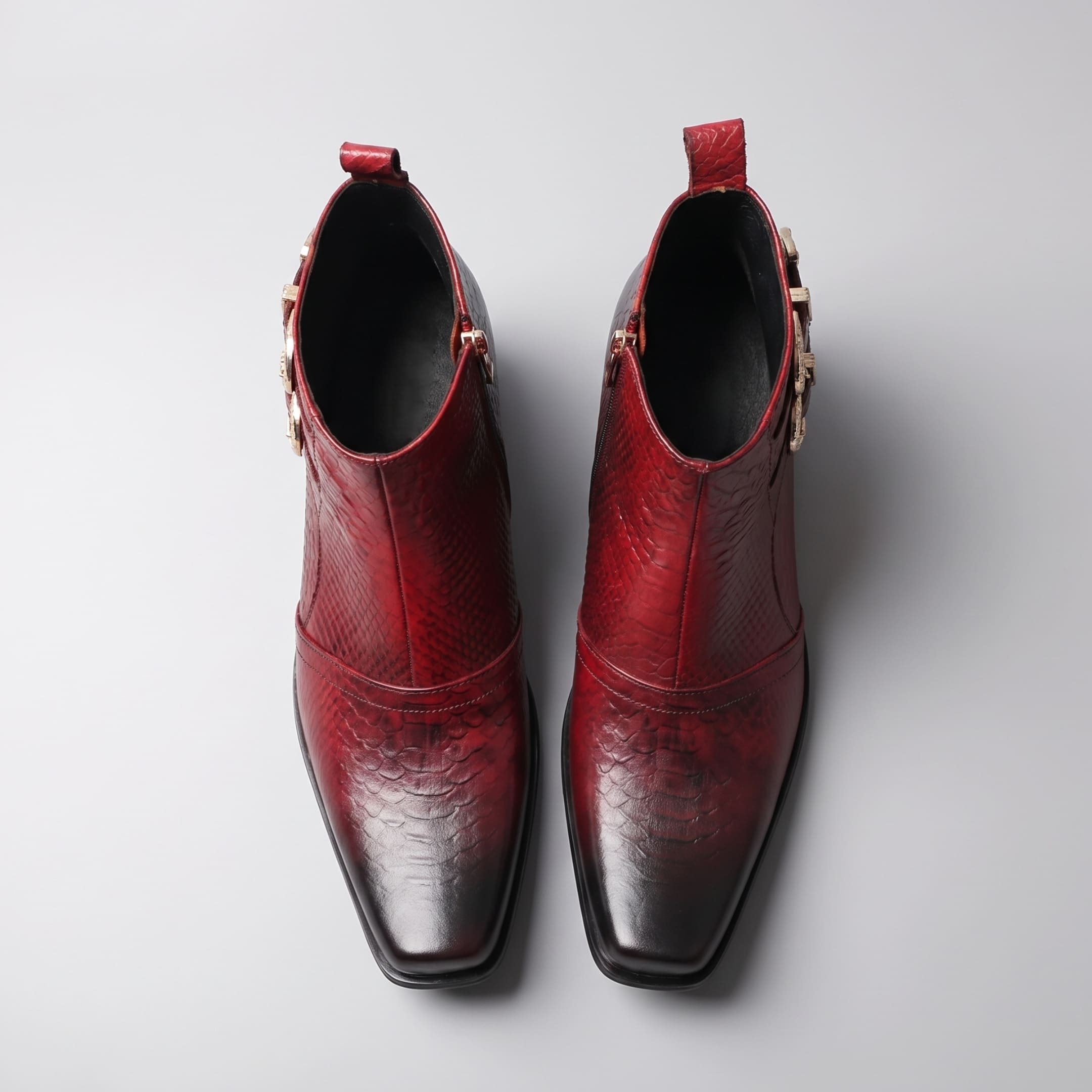 FORCIANO SCAROSSO red genuine leather height increasing boots shown as a pair from the top with textured leather, square toes and side openings.