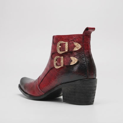FORCIANO SCAROSSO red genuine leather height increasing boot in rear three-quarter view showing two gold-tone buckles, textured upper and black block heel.