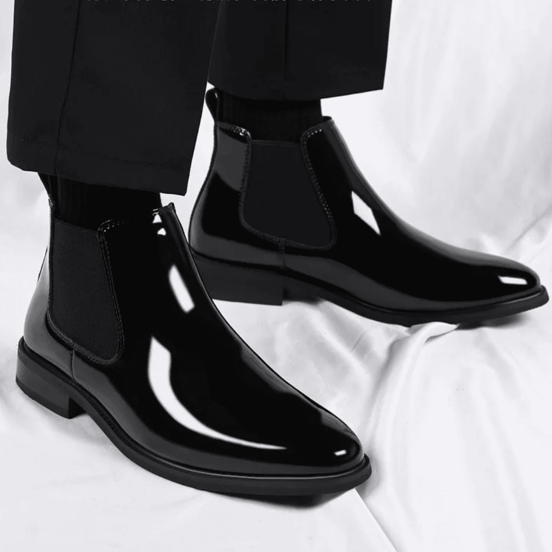FORCIANO SILVAN black height increasing boots worn as a pair from a front three-quarter angle with elastic side panels visible.