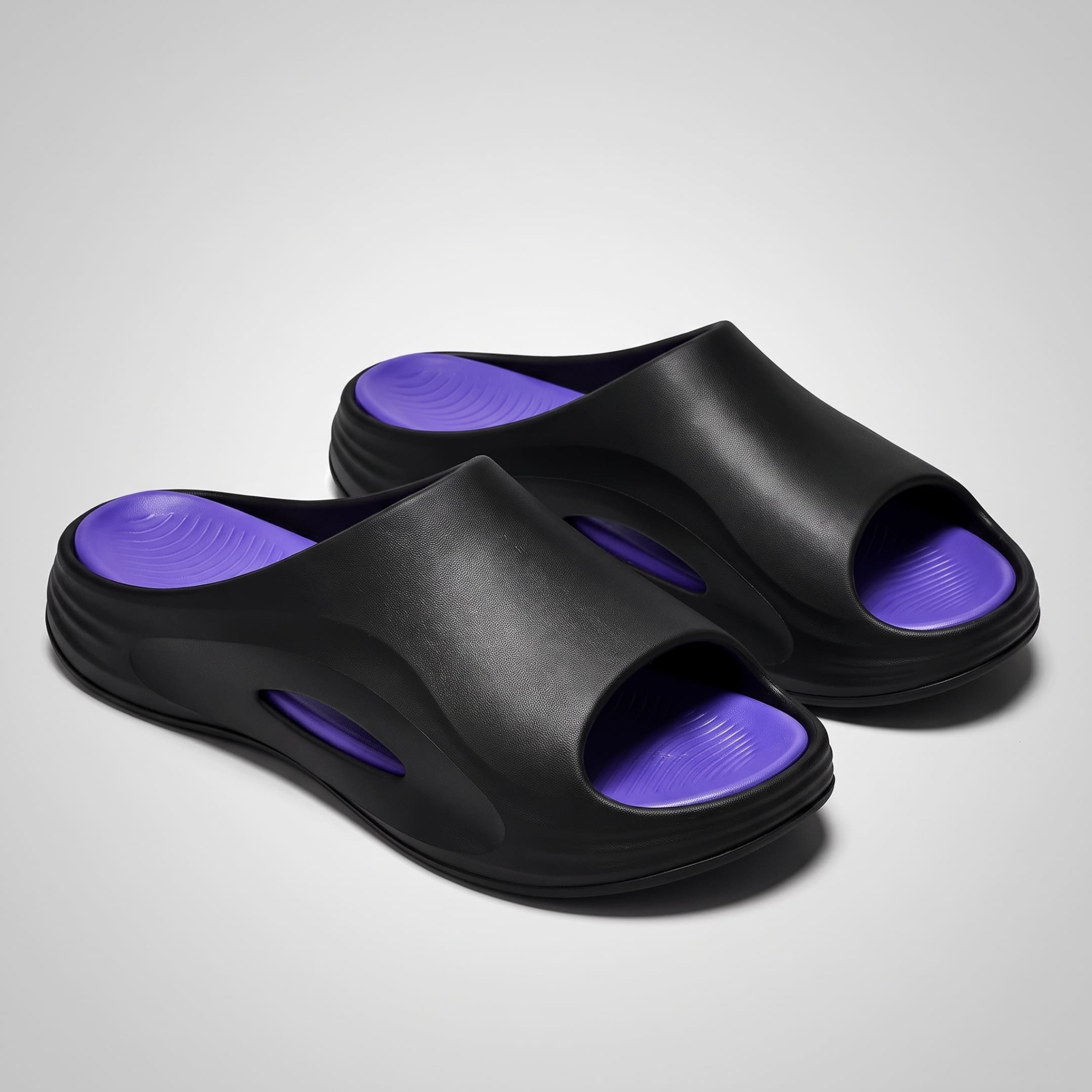 FORCIANO STRIKE Black Purple sandals height increasing shoes shown as a pair from a front three-quarter angle with purple footbeds and cushioned soles visible.
