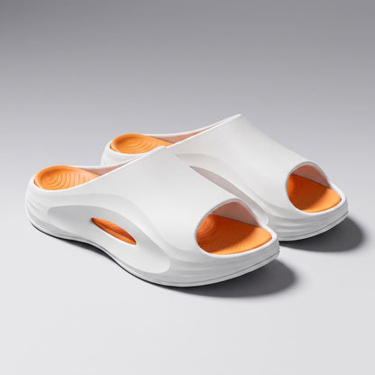 FORCIANO STRIKE White Orange sandals height increasing shoes shown as a pair in a front three-quarter view with orange footbeds.