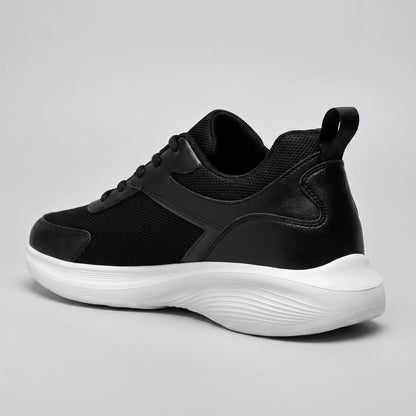 FORCIANO SUTTON black height increasing sneakers for women shown from a rear three-quarter angle with Flyknit mesh upper and contrasting white sole.