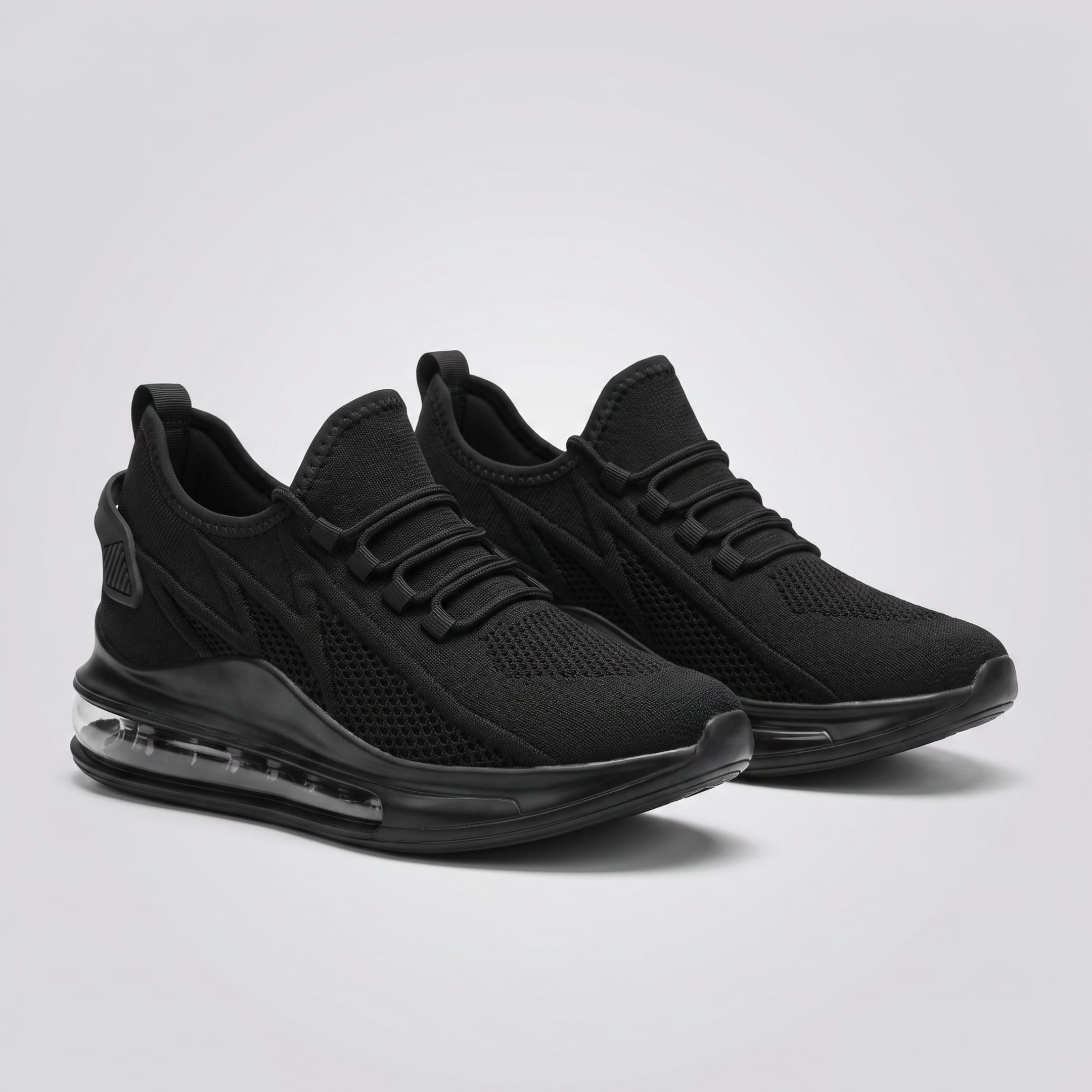 FORCIANO TENET black height increasing sneakers in breathable air mesh, shown as a pair from a front three-quarter angle.