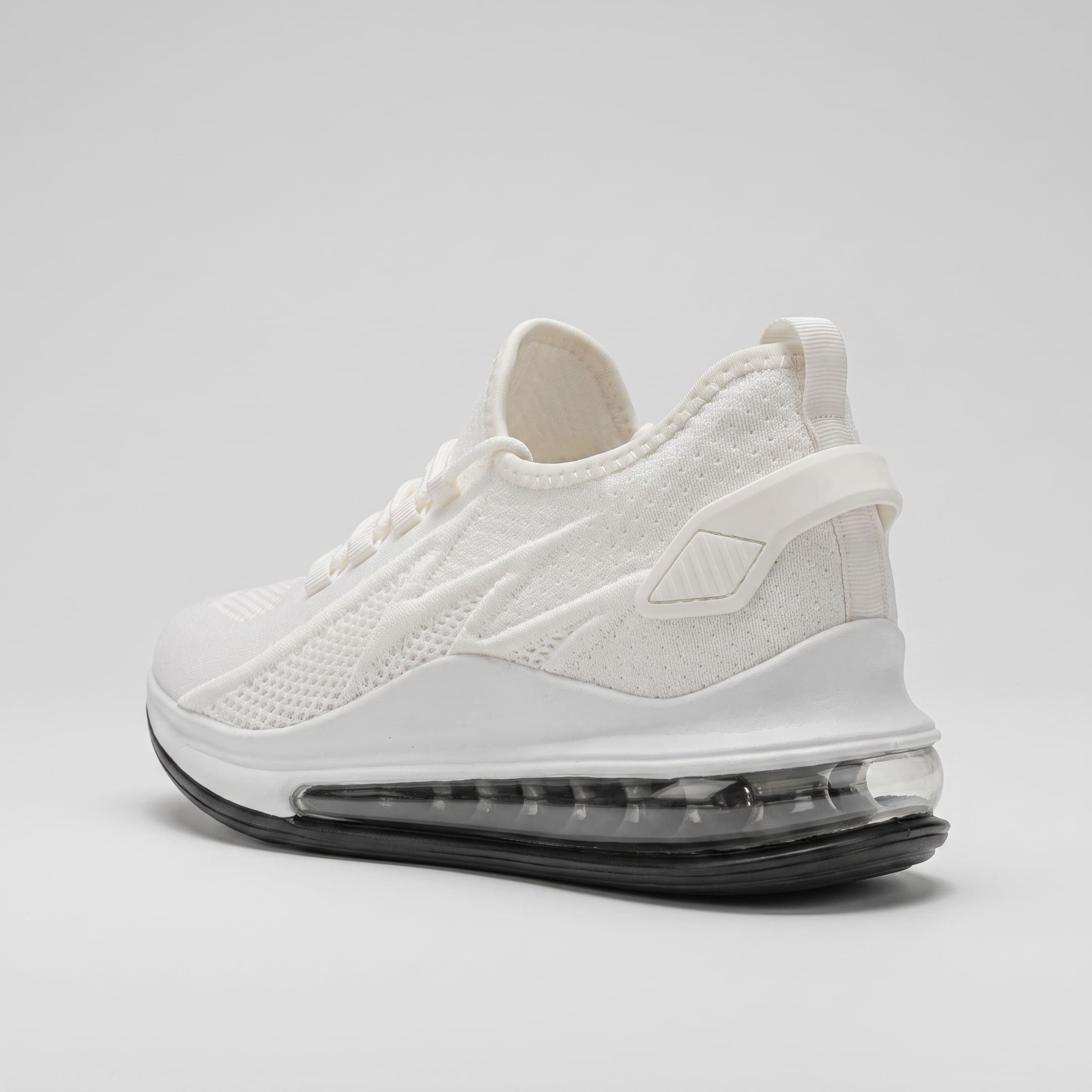 FORCIANO TENET white breathable air mesh height increasing sneakers shown from a rear three-quarter angle with the transparent heel sole section visible.