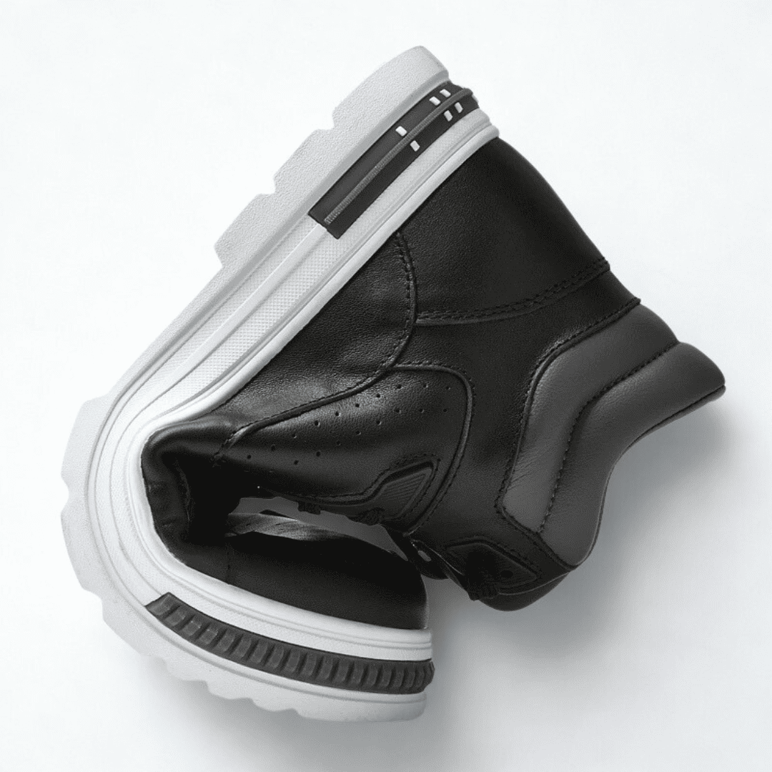 FORCIANO VADER black height increasing sneaker with a white sole shown bent inward, displaying the shoe profile and sole shape.