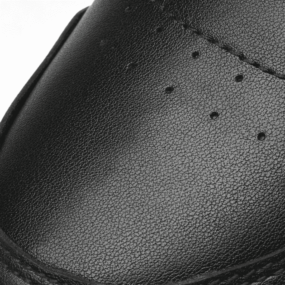 FORCIANO VADER black height increasing sneaker upper close-up showing fine surface texture, stitching, and small perforations.