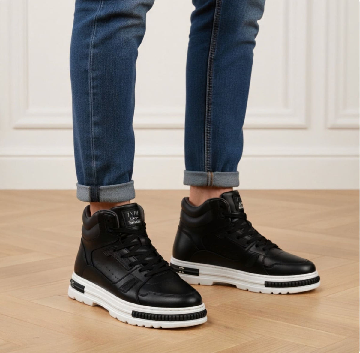 FORCIANO VADER black height increasing sneakers with white soles shown on-foot in a front three-quarter indoor view.