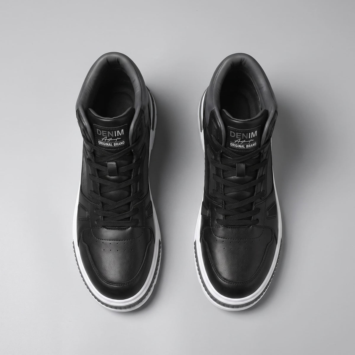 Pair of FORCIANO VADER Height Increasing Sneakers in black, shown from the top with black laces and padded collars visible.