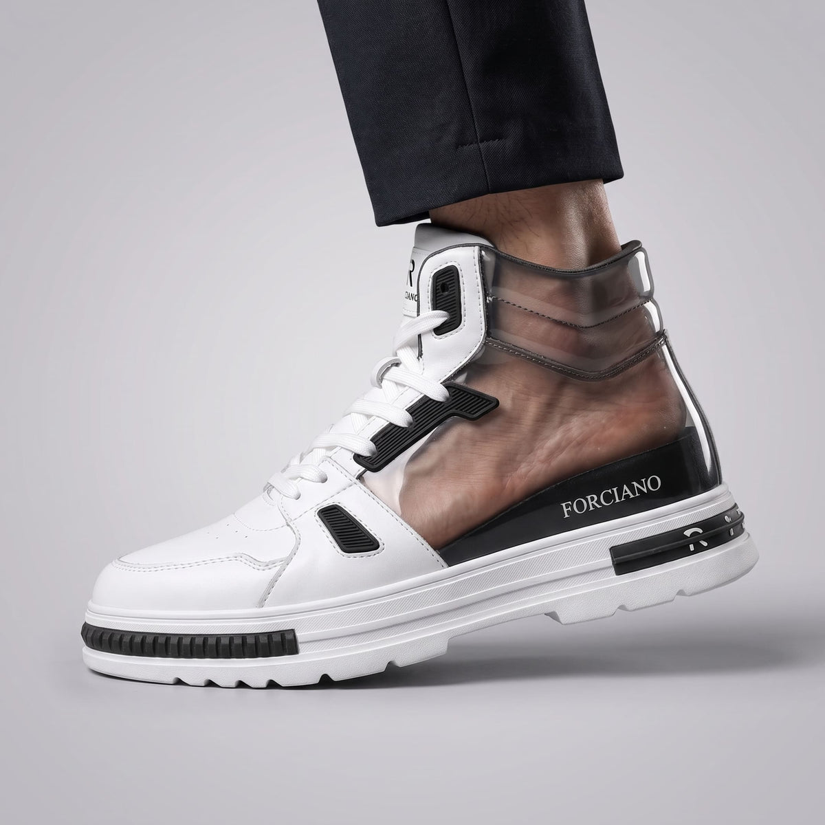 FORCIANO VADER Height Increasing Sneakers in white and black shown on foot with a transparent cutaway revealing the internal lift.