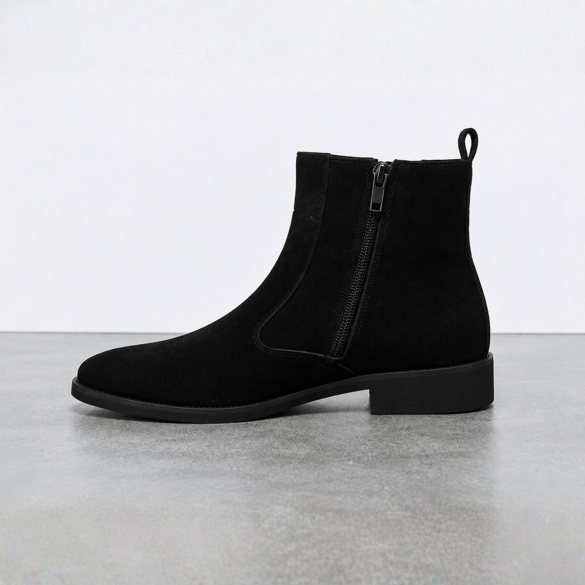 FORCIANO VALKYRIE black women's elevator boots in side profile, highlighting the premium suede upper, visible side zipper, pull tab and black heel.