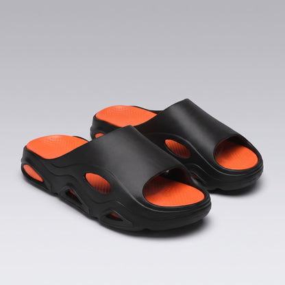 Pair of black-and-orange FORCIANO VECTOR EVA sandals shown from a front three-quarter angle as height increasing shoes.