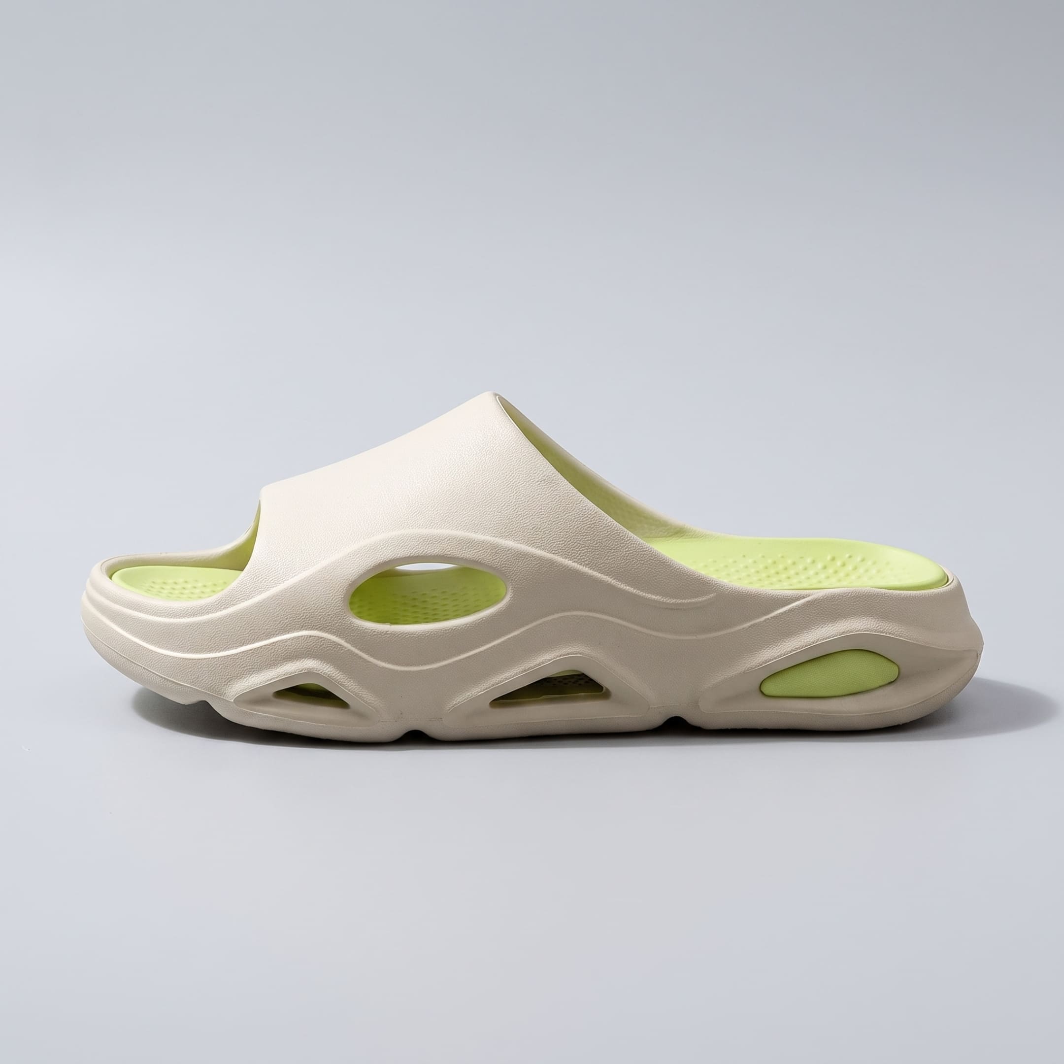 Single cream-and-green FORCIANO VECTOR EVA sandal shown from the side, presenting the profile of the height increasing shoes.