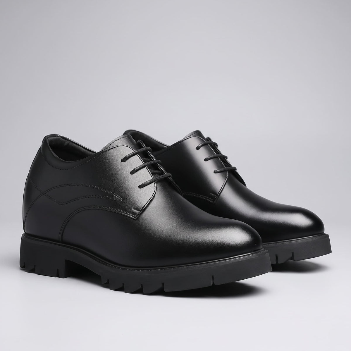 FORCIANO WINDSOR black Height-Increasing Shoes shown as a leather pair from the front three-quarter angle with smooth toes and lug-style soles.
