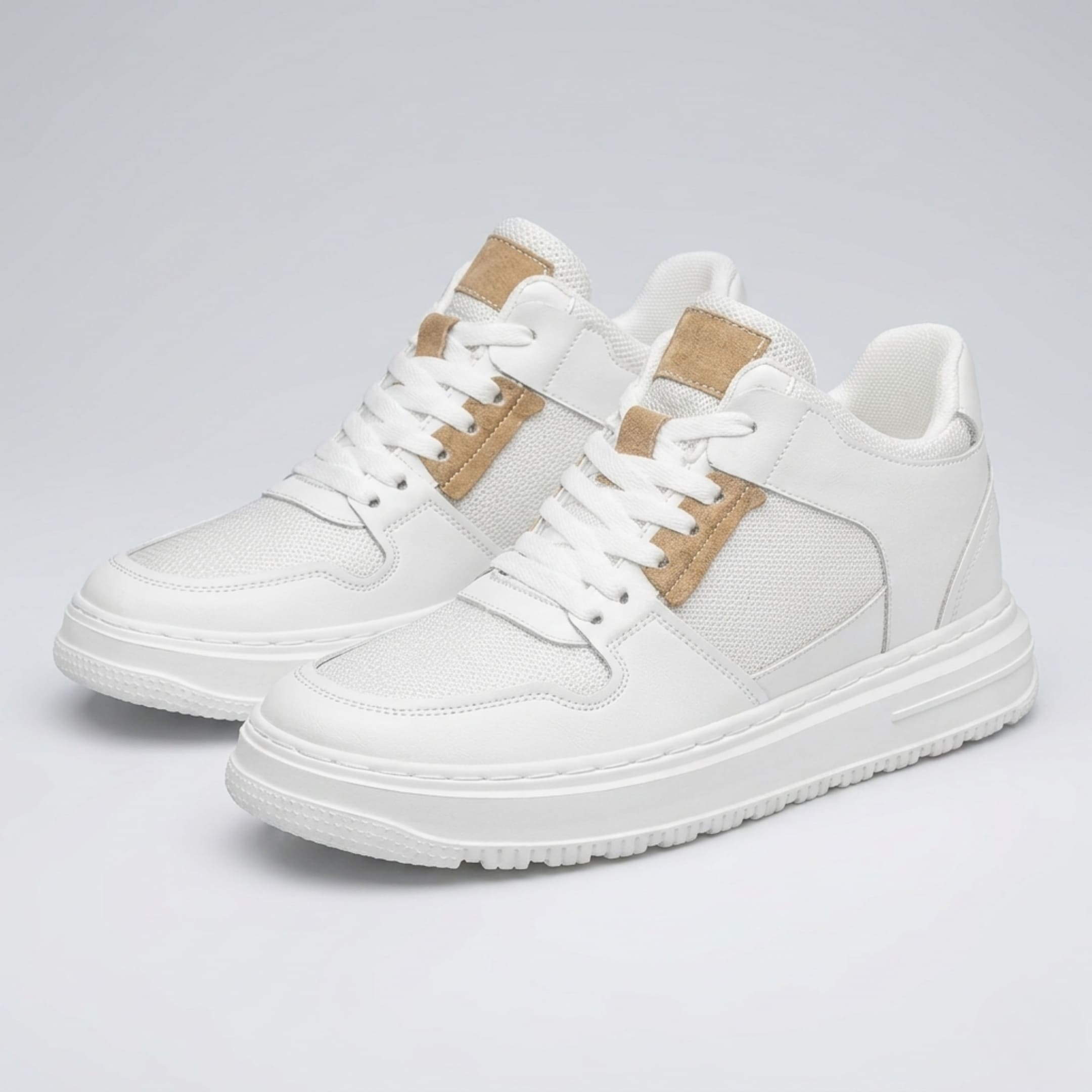 FORCIANO ZENITH white elevator sneakers with breathable air mesh uppers and tan accents shown as a pair from a front three-quarter angle.