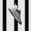 FORCIANO PRIME white height increasing sneakers shown in motion with black and gray reflective accents and up to 8 cm / 3.15" discreet height increase.